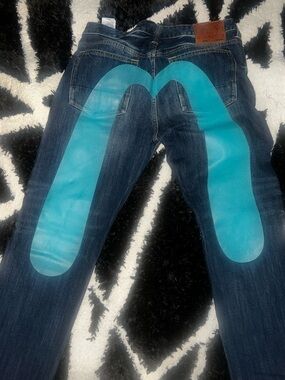 Evisu Men's Dark Blue Jeans with Turquoise Back Graphic